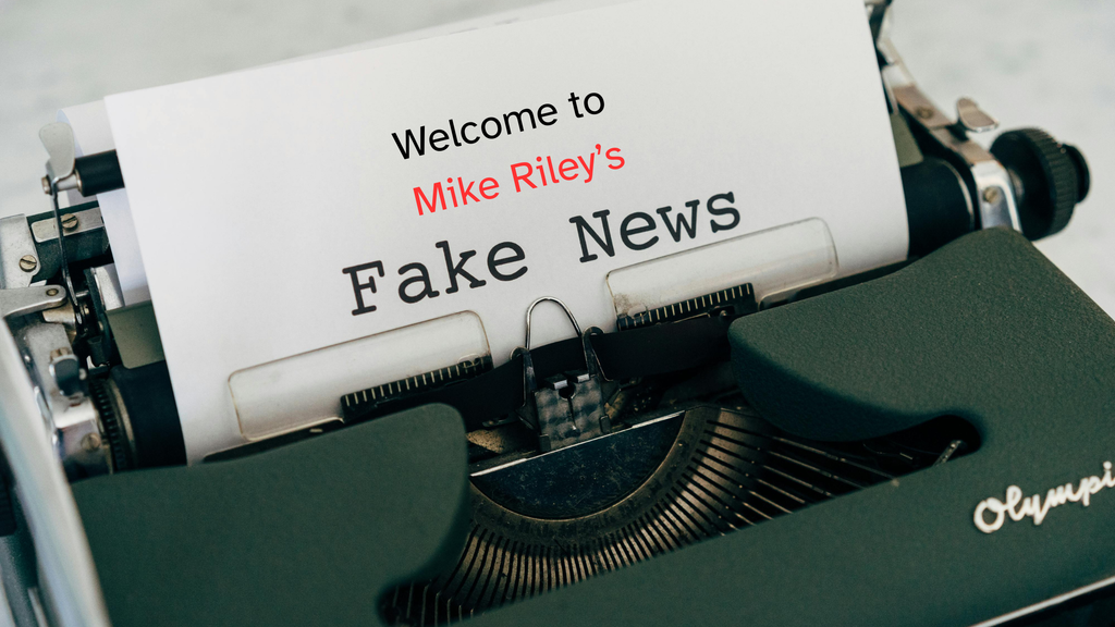 Vintage typewriter holding a sheet of paper that reads “Welcome to Mike Riley's Fake News.”